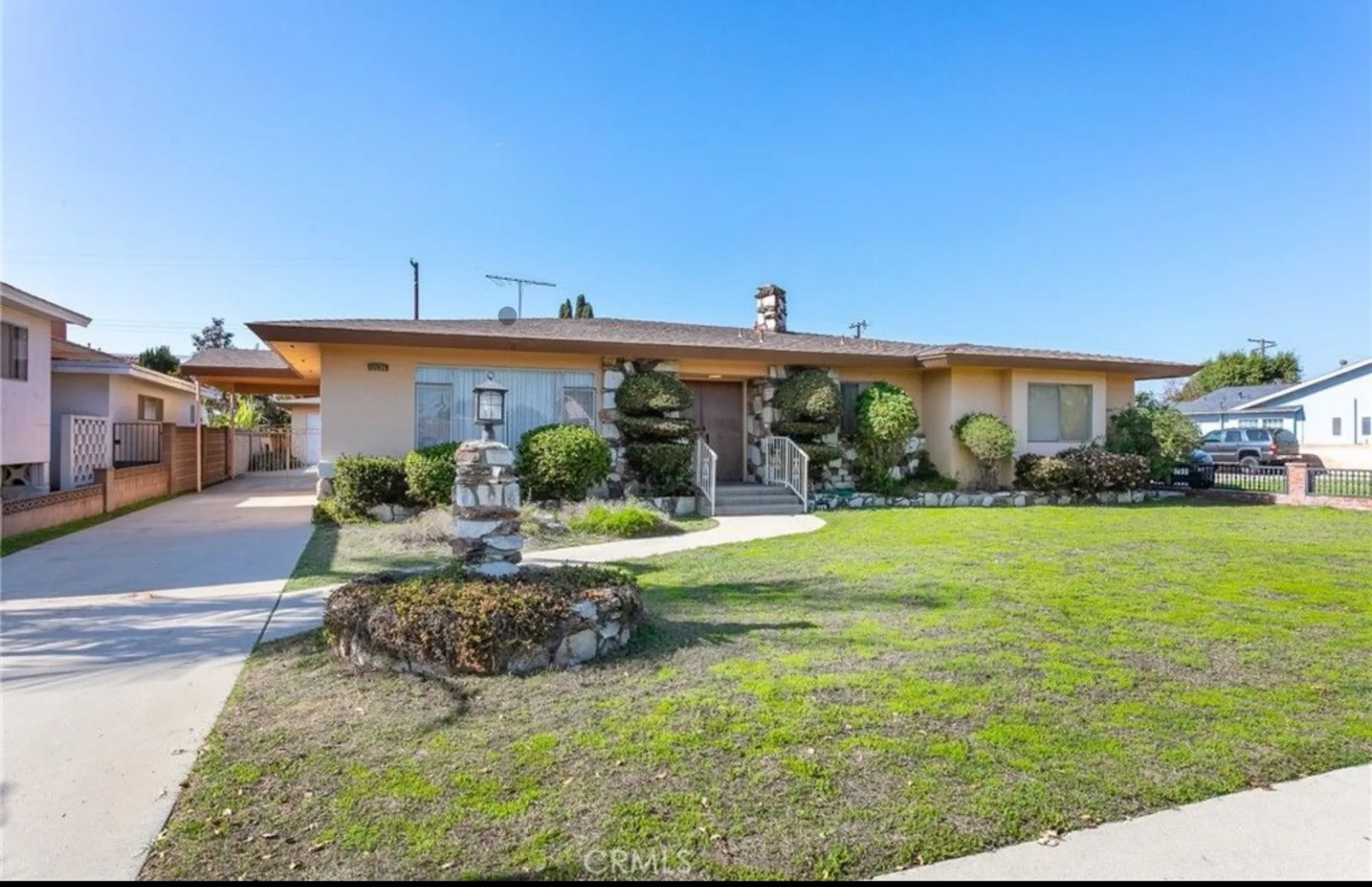 Front exterior of the existing single-story home in Downey before the remodel